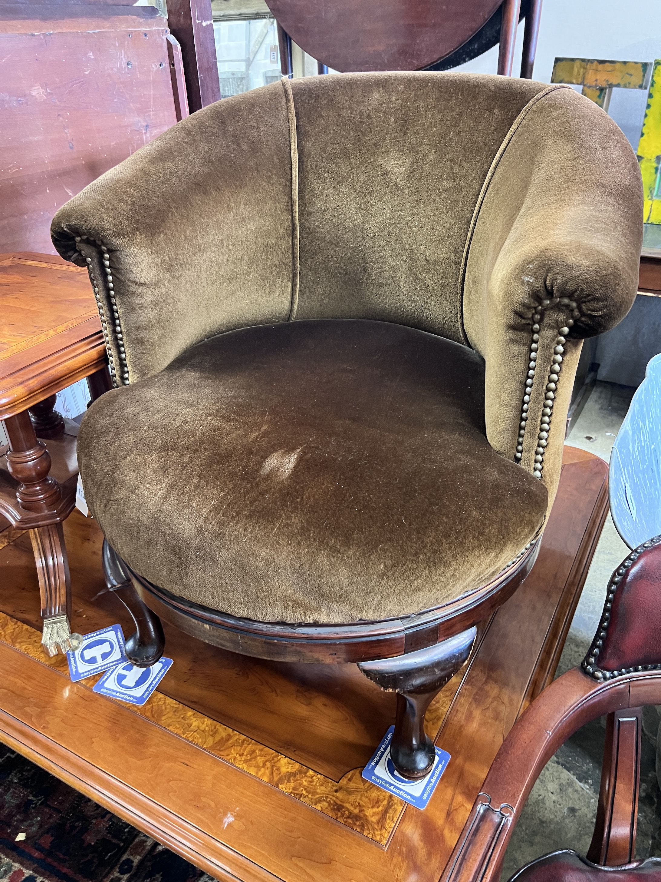 A 1930's mahogany framed revolving tub armchair, width 72cm